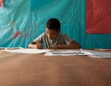 CCSA student working at a table